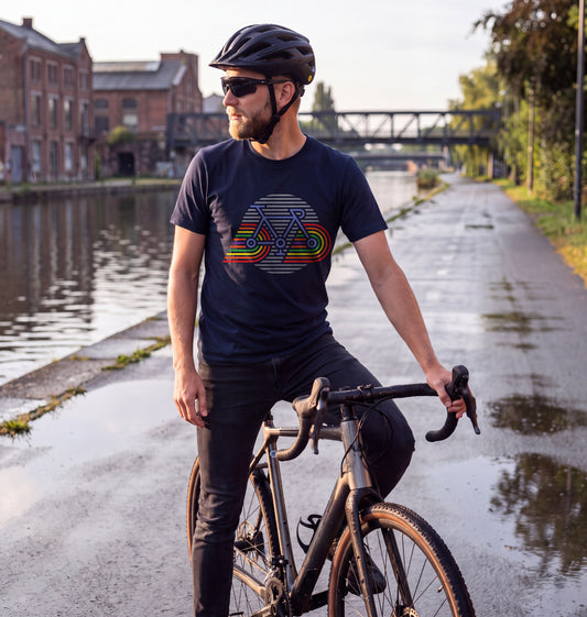 Man in French Navy Retro Bicycle t-shirt with a gravel bike on the canal cycle path in Brussels after morning rain