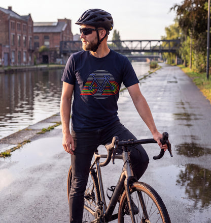 Man in French Navy Retro Bicycle t-shirt with a gravel bike on the canal cycle path in Brussels after morning rain