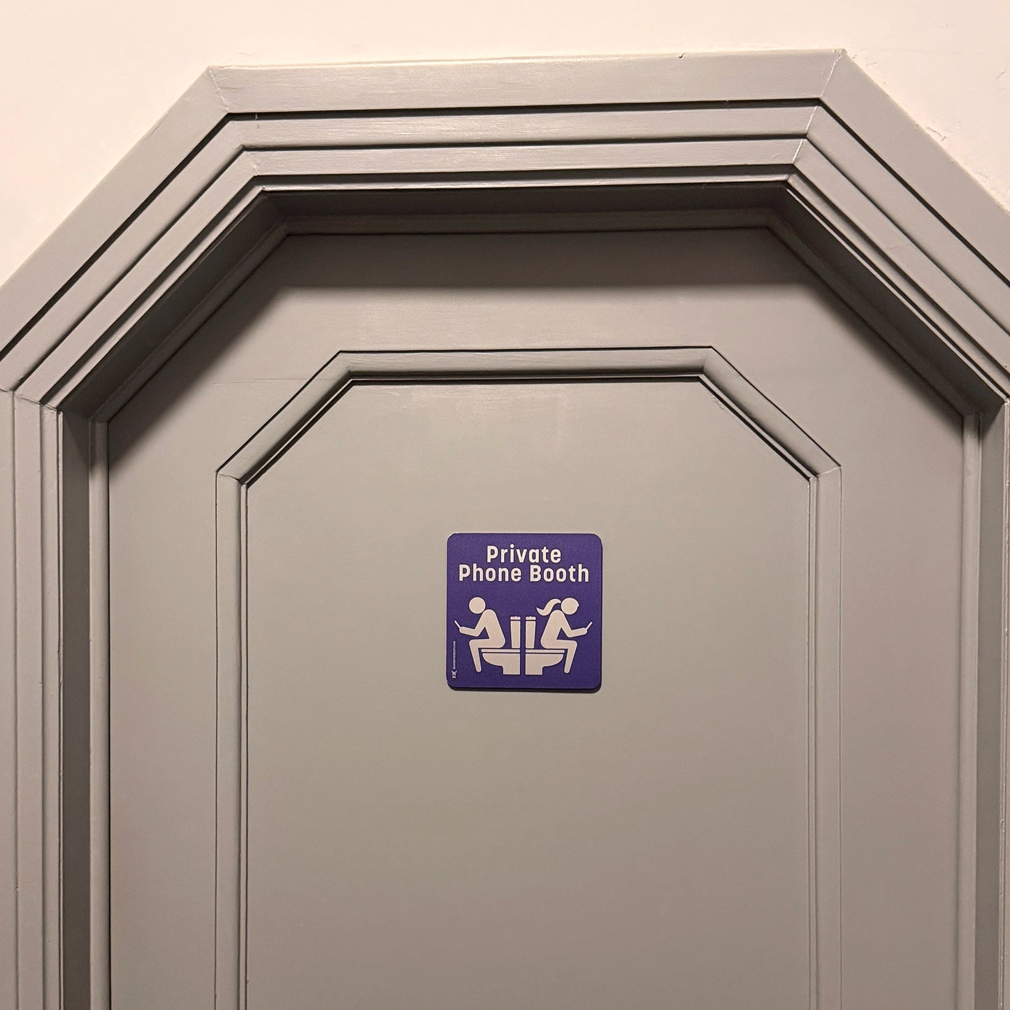 Funny restroom unisex sign 'Private phone booth'